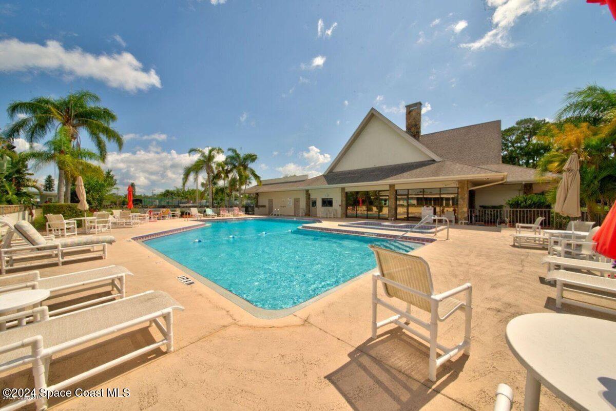 276 Timber Run Way Cocoa, FL 32926 - Photo 10 of 18 a swimming pool with outdoor seating and yard