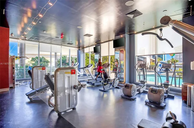 a view of a livingroom with furniture water view and a large window
