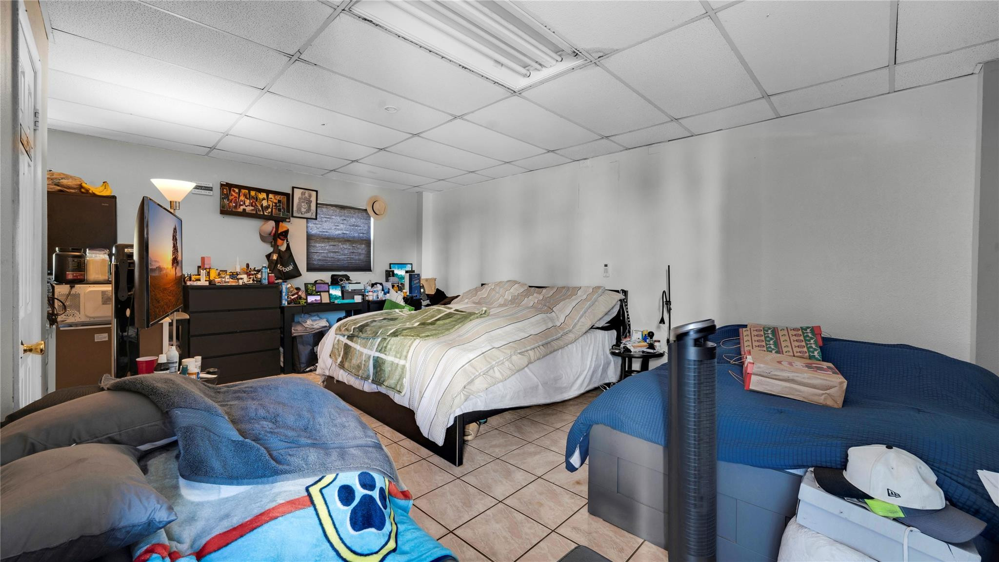 820 Northwest 23rd Street Miami, FL 33127 - Photo 43 of 64 a bedroom with bed and a couch