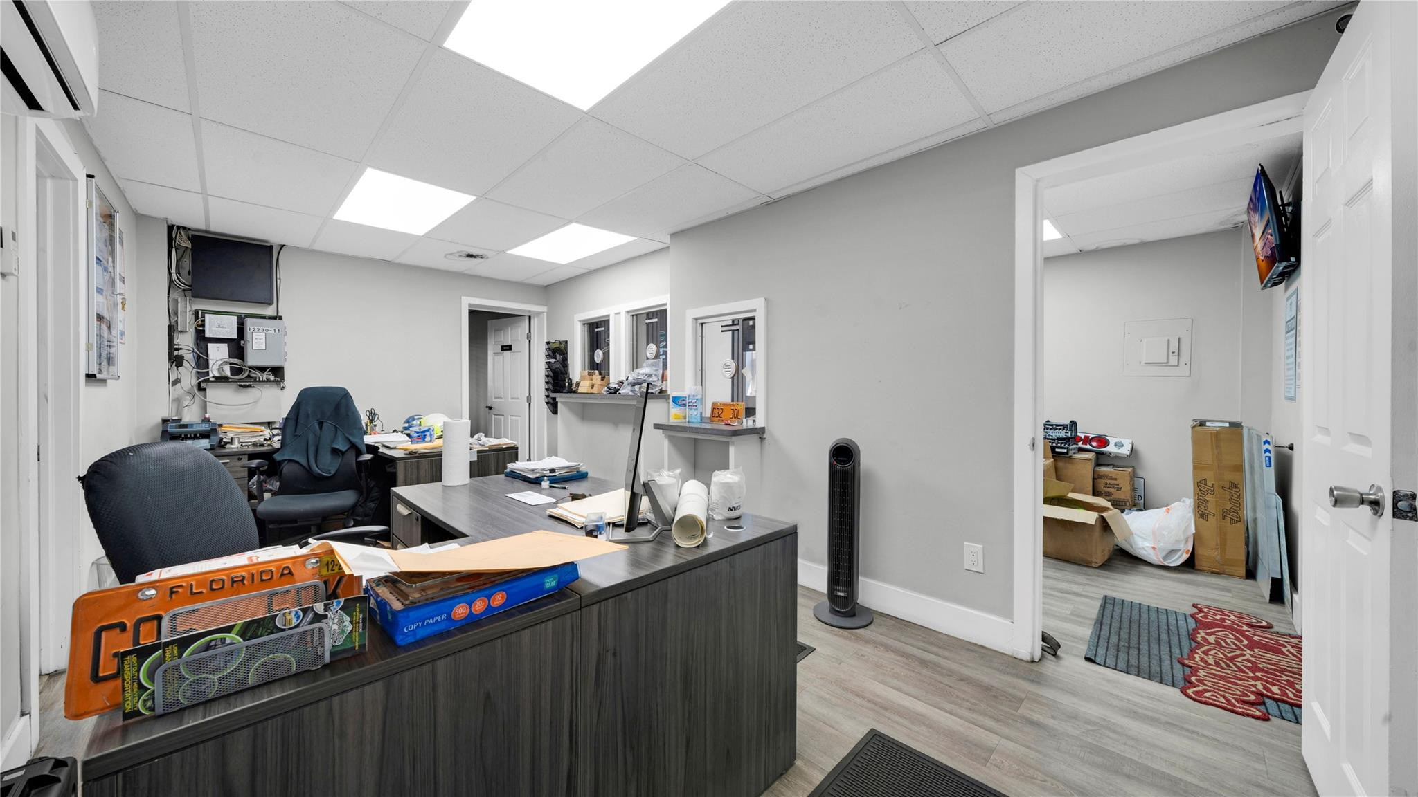 820 Northwest 23rd Street Miami, FL 33127 - Photo 55 of 64 a living room with furniture a flat screen tv and a table