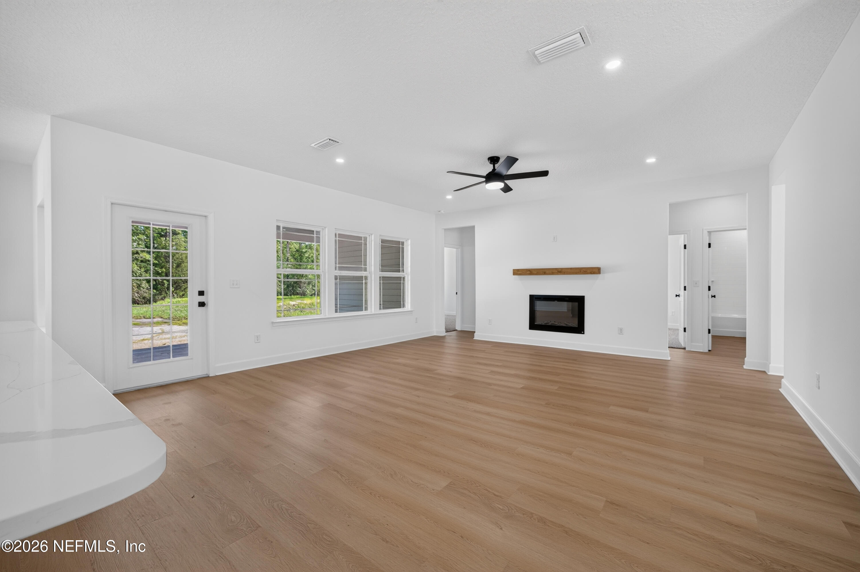 4362 Angora Street Middleburg, FL 32068 - Photo 8 of 31 a view of an empty room with a window and fireplace