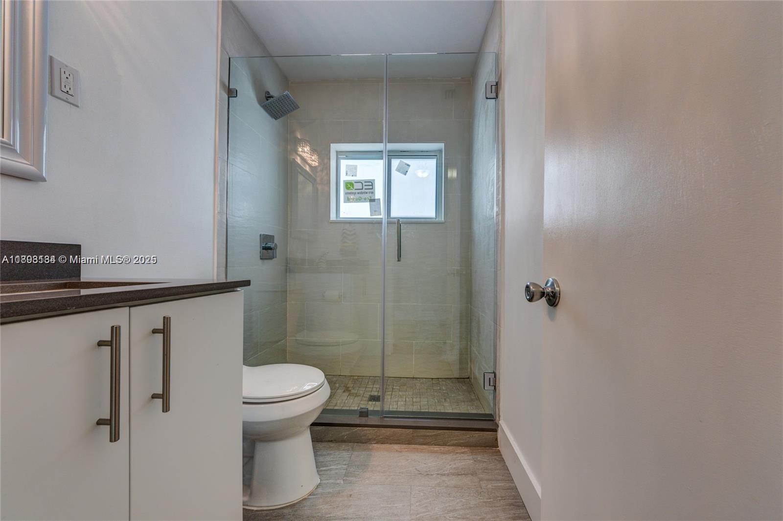 2363 Southwest 21st Terrace Miami, FL 33145 - Photo 12 of 19 a bathroom with a toilet and a shower