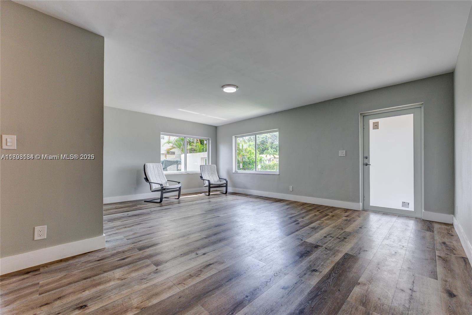 2363 Southwest 21st Terrace Miami, FL 33145 - Photo 5 of 19 a living room with furniture and a wooden floor