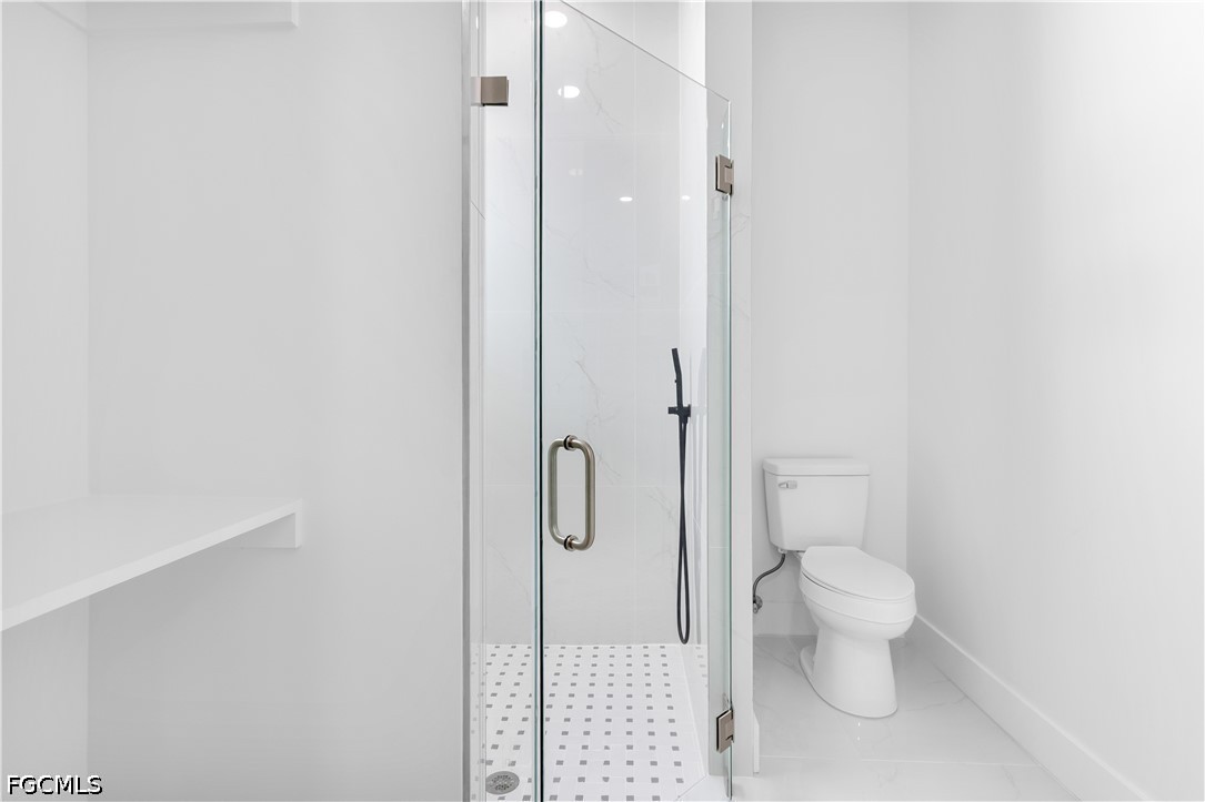 3004 South Tulip Road LaBelle, FL 33935 - Photo 16 of 24 a bathroom with a granite countertop toilet