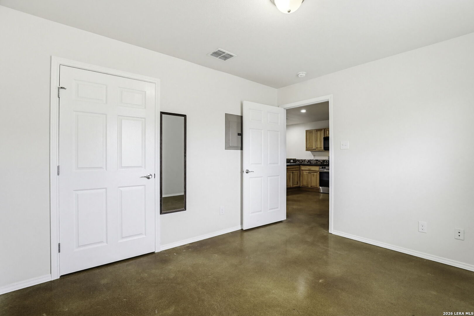 752 Cimarron, Unit B Spring Branch, TX 78070 - Photo 14 of 23 a view of a big room with wooden floor and windows