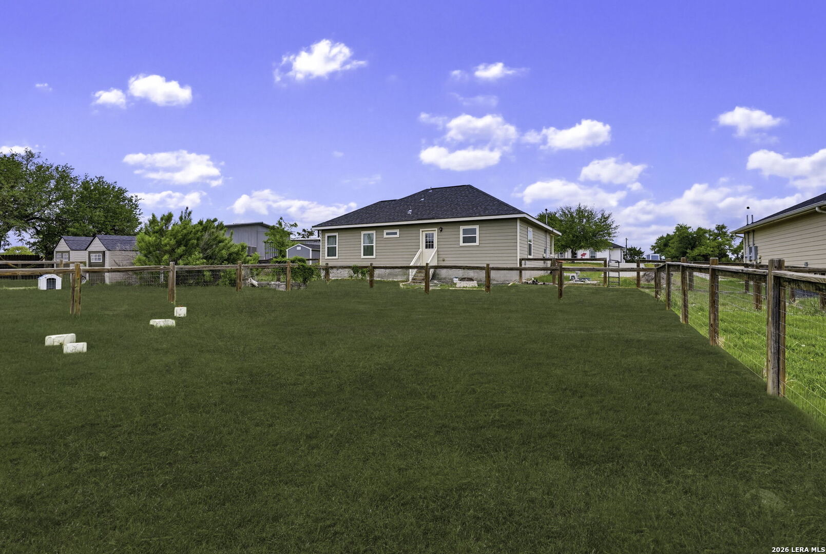 752 Cimarron, Unit B Spring Branch, TX 78070 - Photo 19 of 23 a view of a house with a yard and sitting area