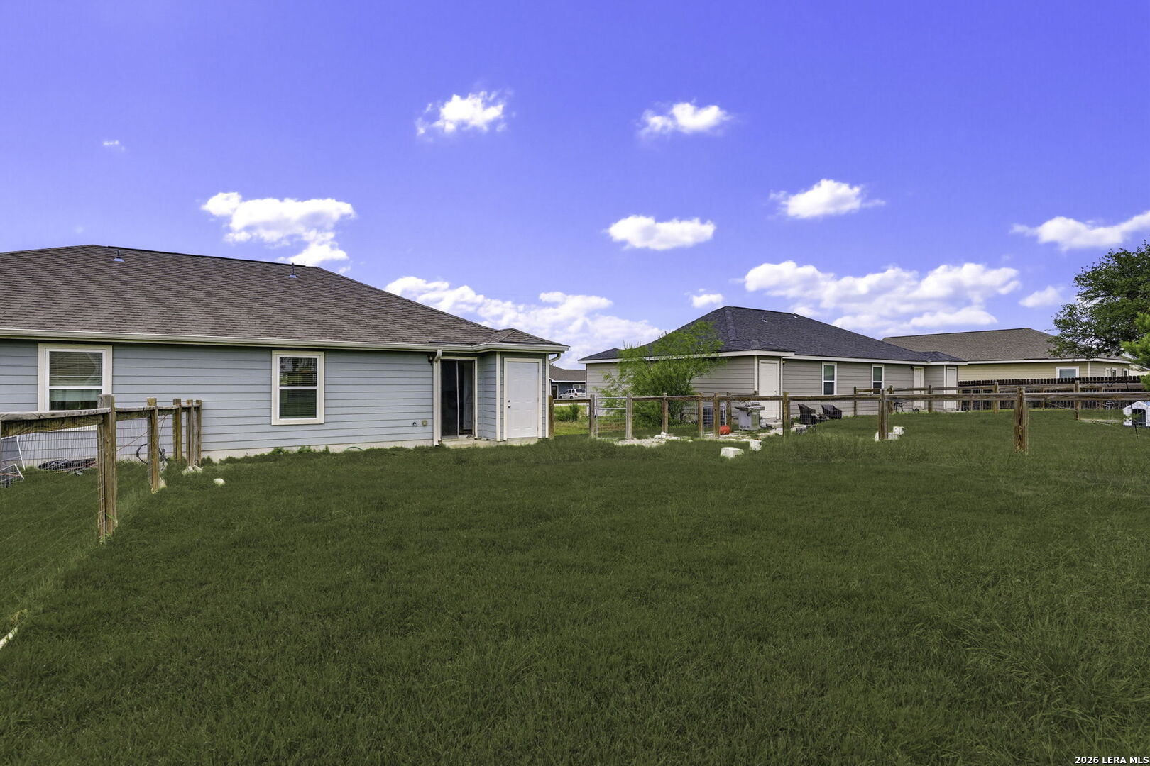 752 Cimarron, Unit B Spring Branch, TX 78070 - Photo 20 of 23 a front view of a house with a garden