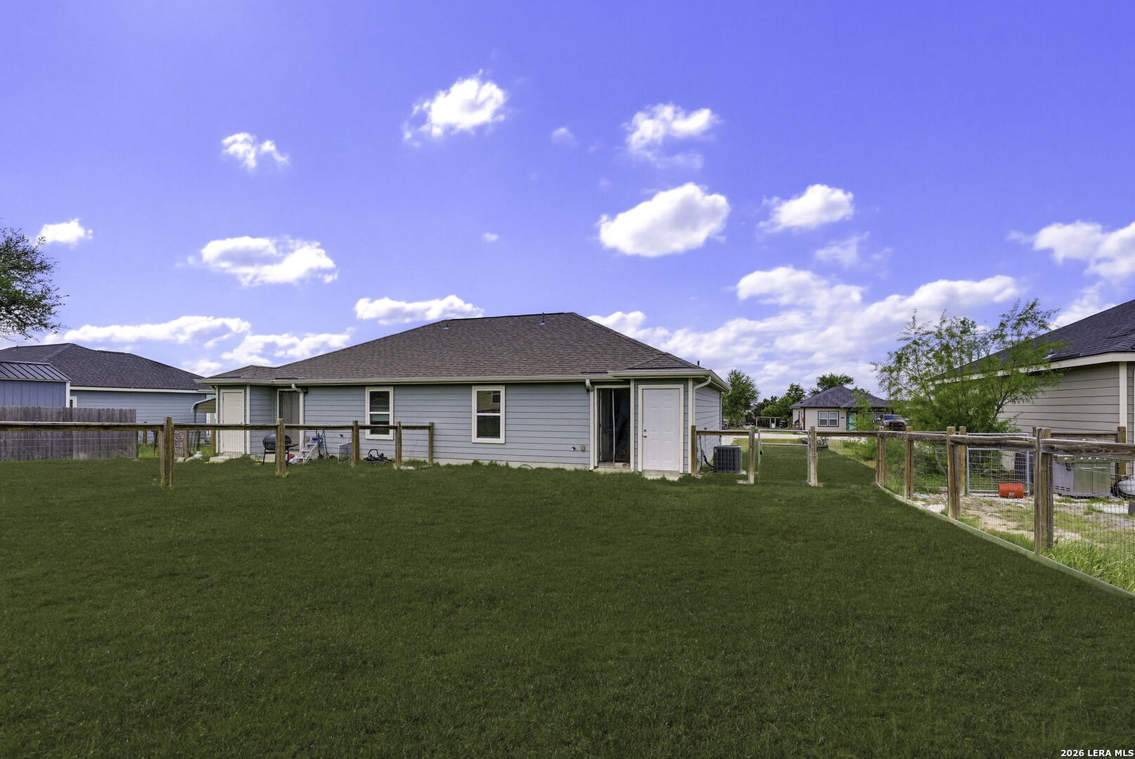 752 Cimarron, Unit B Spring Branch, TX 78070 - Photo 21 of 23 a view of house with outdoor space and yard