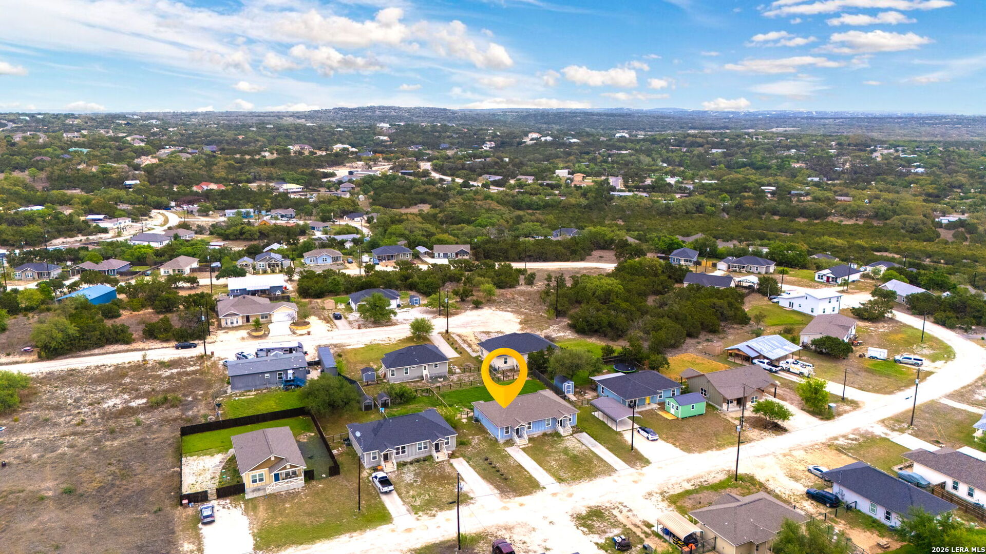 752 Cimarron, Unit B Spring Branch, TX 78070 - Photo 22 of 23 an aerial view of residential houses with outdoor space