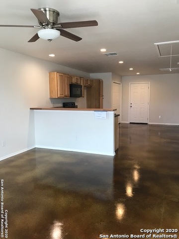 752 Cimarron, Unit B Spring Branch, TX 78070 - Photo 3 of 6 an empty room with wooden floor and ceiling fan
