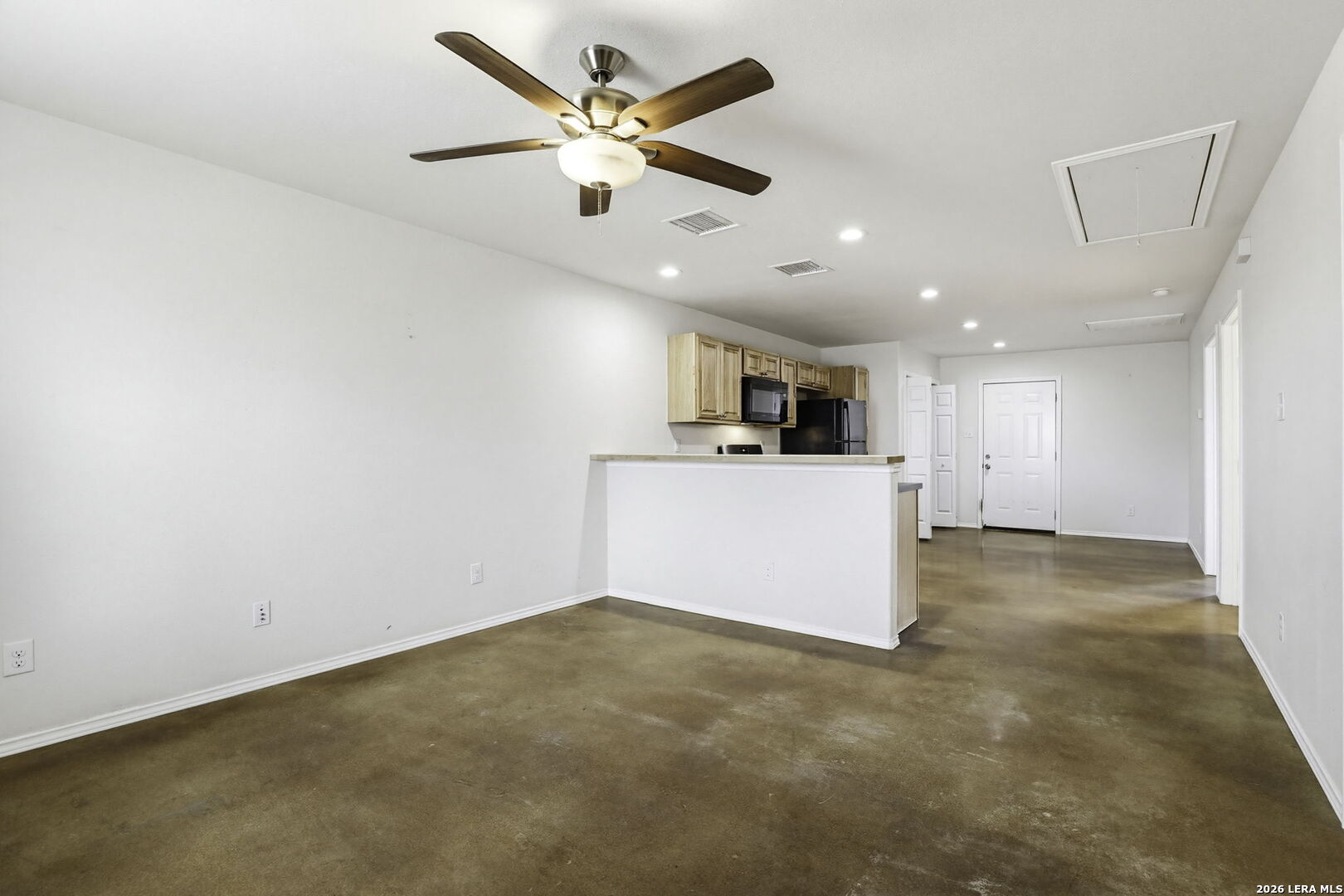 752 Cimarron, Unit B Spring Branch, TX 78070 - Photo 3 of 23 an empty room with ceiling fan and window
