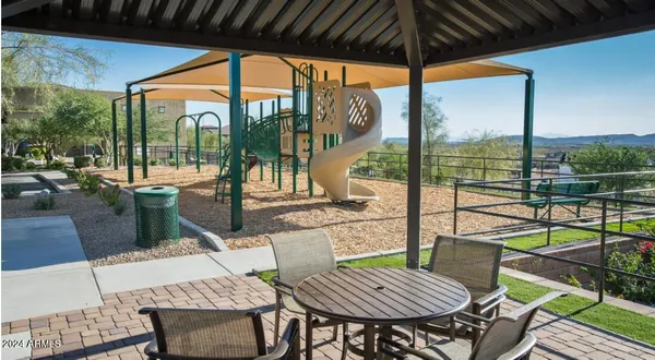 a view of a patio with a table chairs and a table