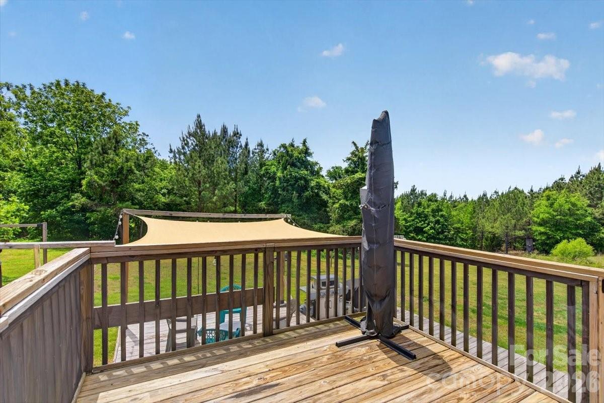 567 Godbey Road Mocksville, NC 27028 - Photo 22 of 38 a view of a wooden roof deck