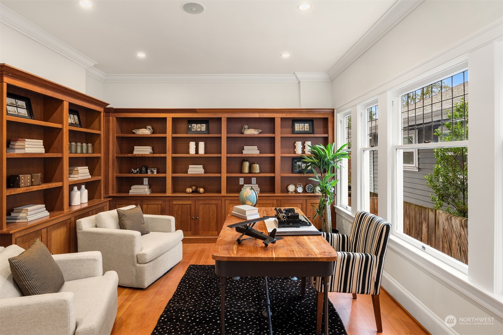3206 East Terrace Street Seattle, WA 98122 - Photo 15 of 28 a view of a livingroom with furniture and a book shelf