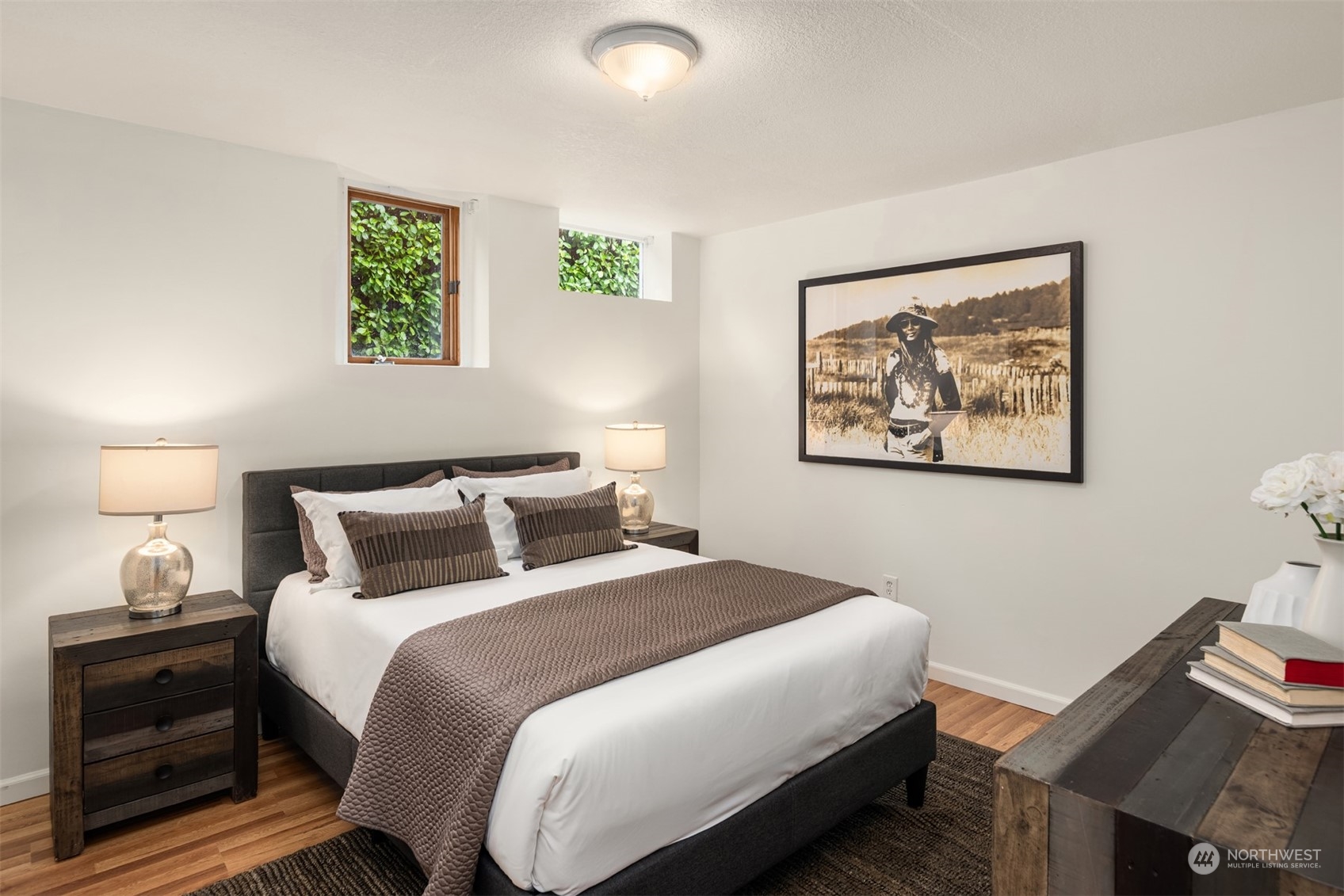 3206 East Terrace Street Seattle, WA 98122 - Photo 24 of 28 a bedroom with bed and a painting on the wall