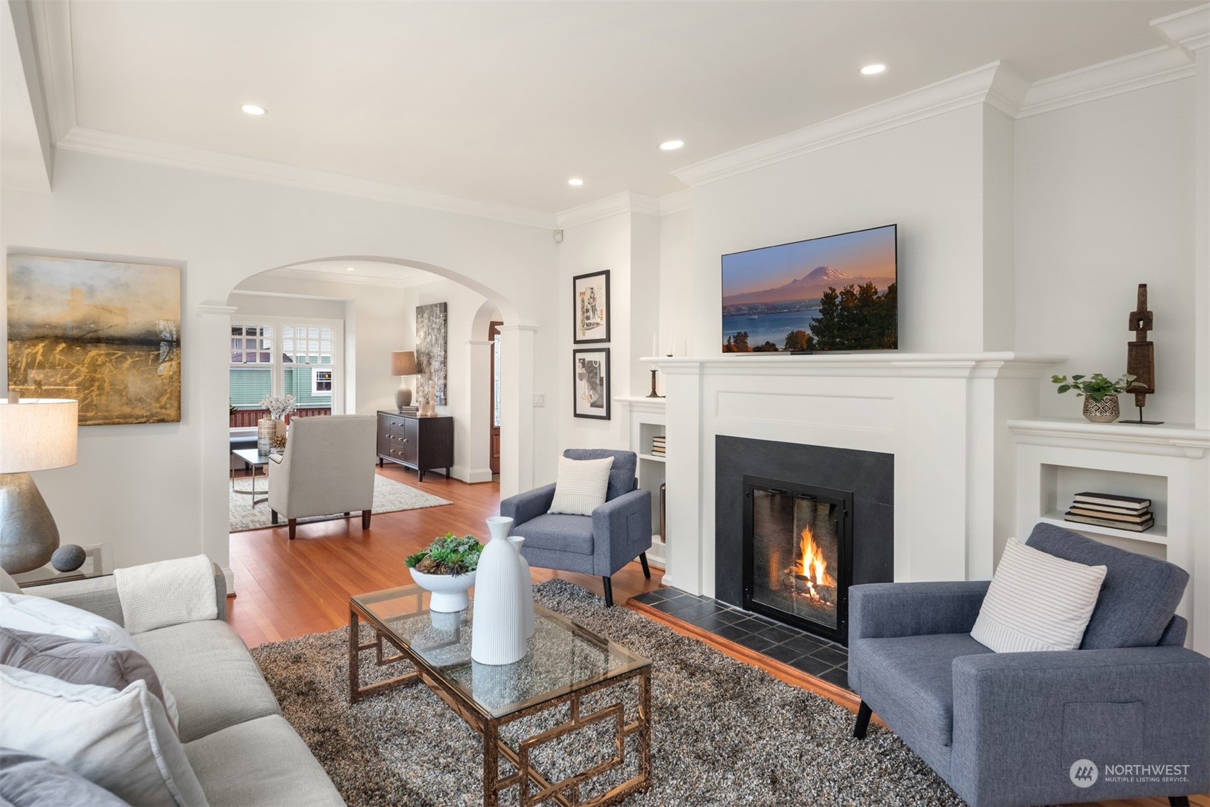 3206 East Terrace Street Seattle, WA 98122 - Photo 8 of 28 a living room with furniture a flat screen tv and a fireplace
