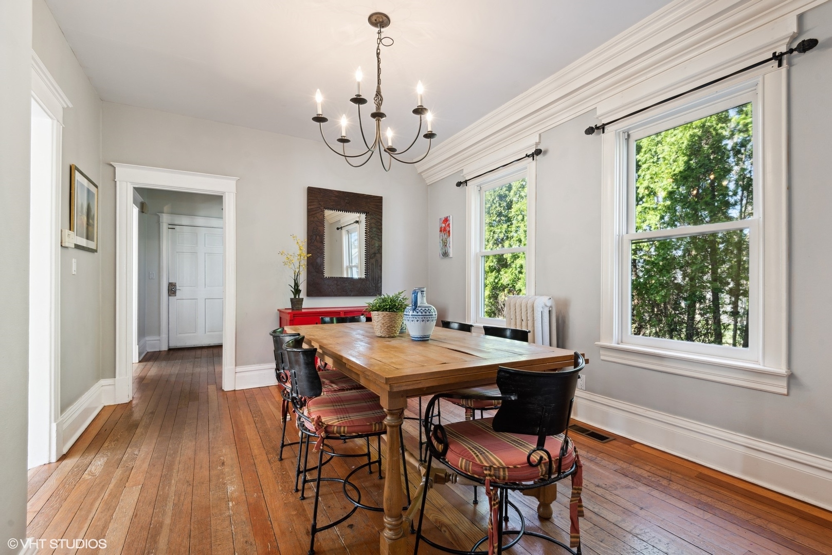 189 Ridge Avenue Winnetka, IL 60093 - Photo 7 of 29 a view of a dining room with furniture a chandelier and wooden floor