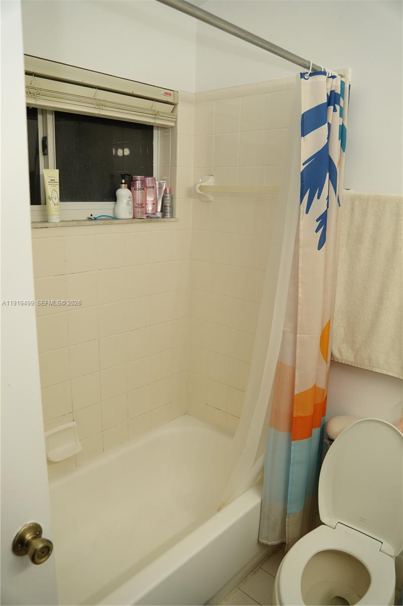 159 Hidden Ct Road Hollywood, FL 33023 - Photo 22 of 29 a bathroom with a shower and a toilet