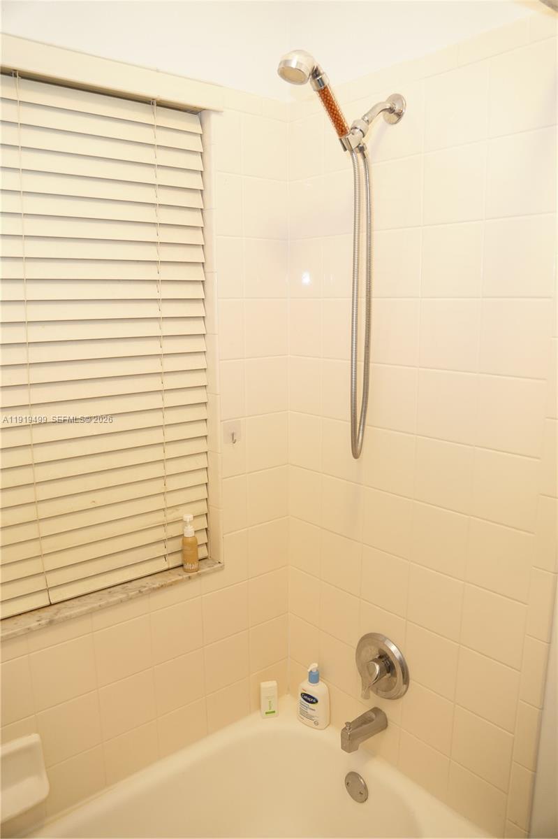159 Hidden Ct Road Hollywood, FL 33023 - Photo 27 of 29 a bathroom with a bathtub and a shower