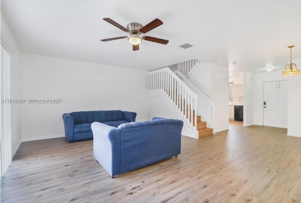 159 Hidden Ct Road Hollywood, FL 33023 - Photo 5 of 29 a living room with couches and a view of kitchen
