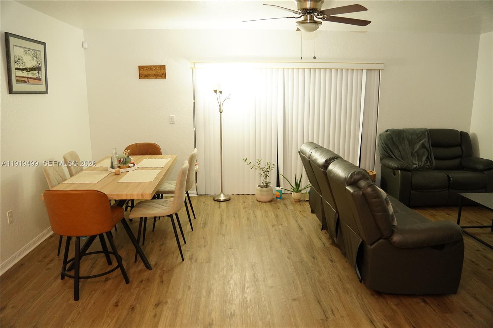 159 Hidden Ct Road Hollywood, FL 33023 - Photo 8 of 29 a living room with furniture and a wooden floor