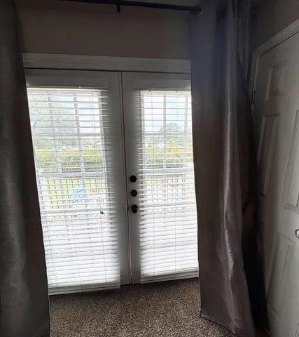 a view of a room that has a window in it