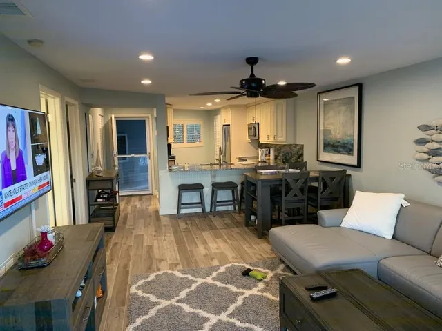 a kitchen with granite countertop a stove and a sink