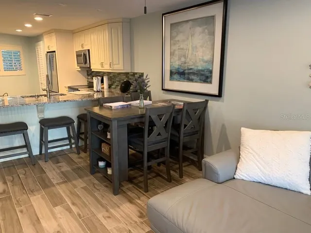 a view of a living room and hardwood floor