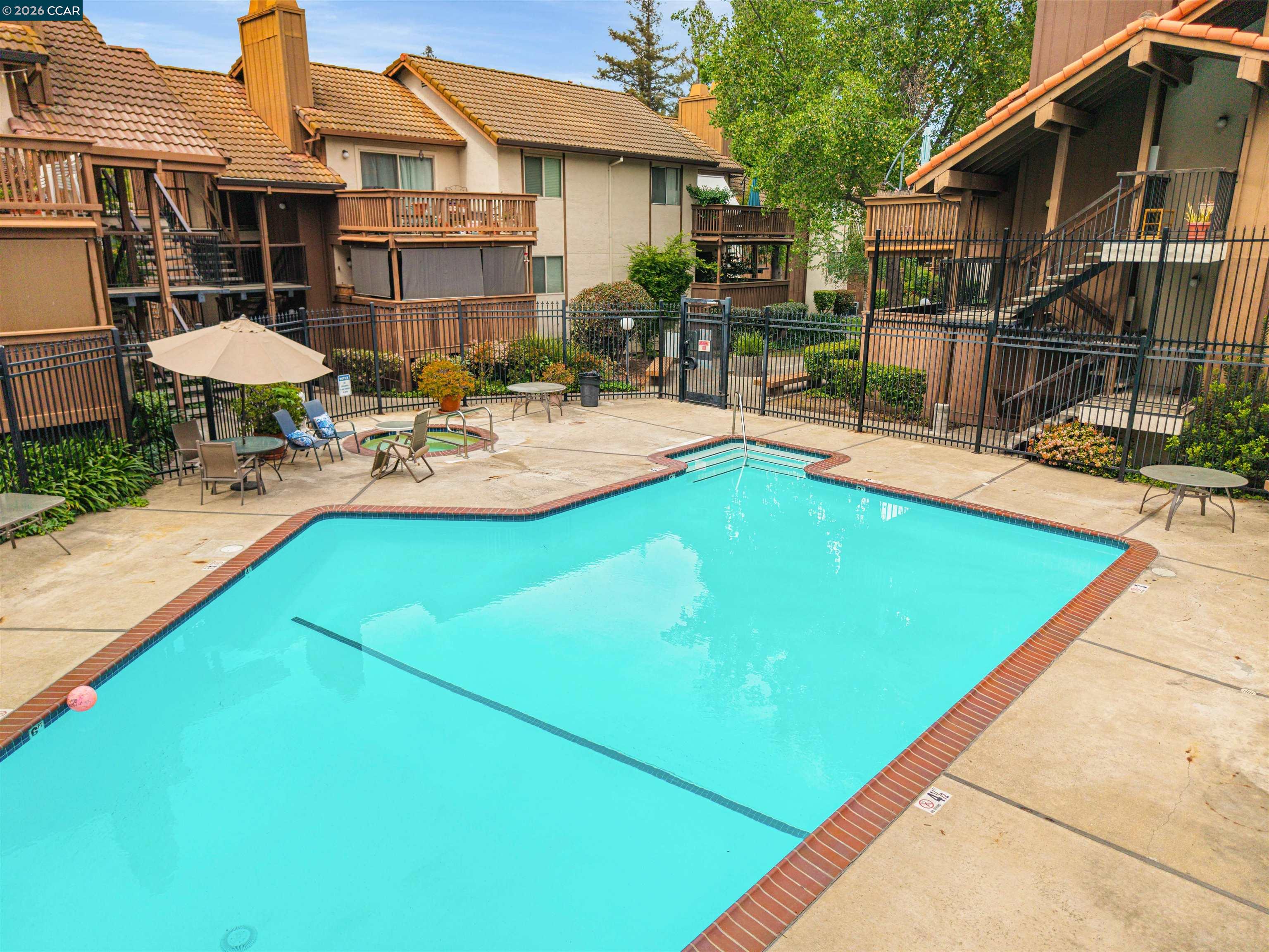 2055 Sierra Road, Unit 106 Concord, CA 94518 - Photo 33 of 37 a view of a house with swimming pool and sitting area