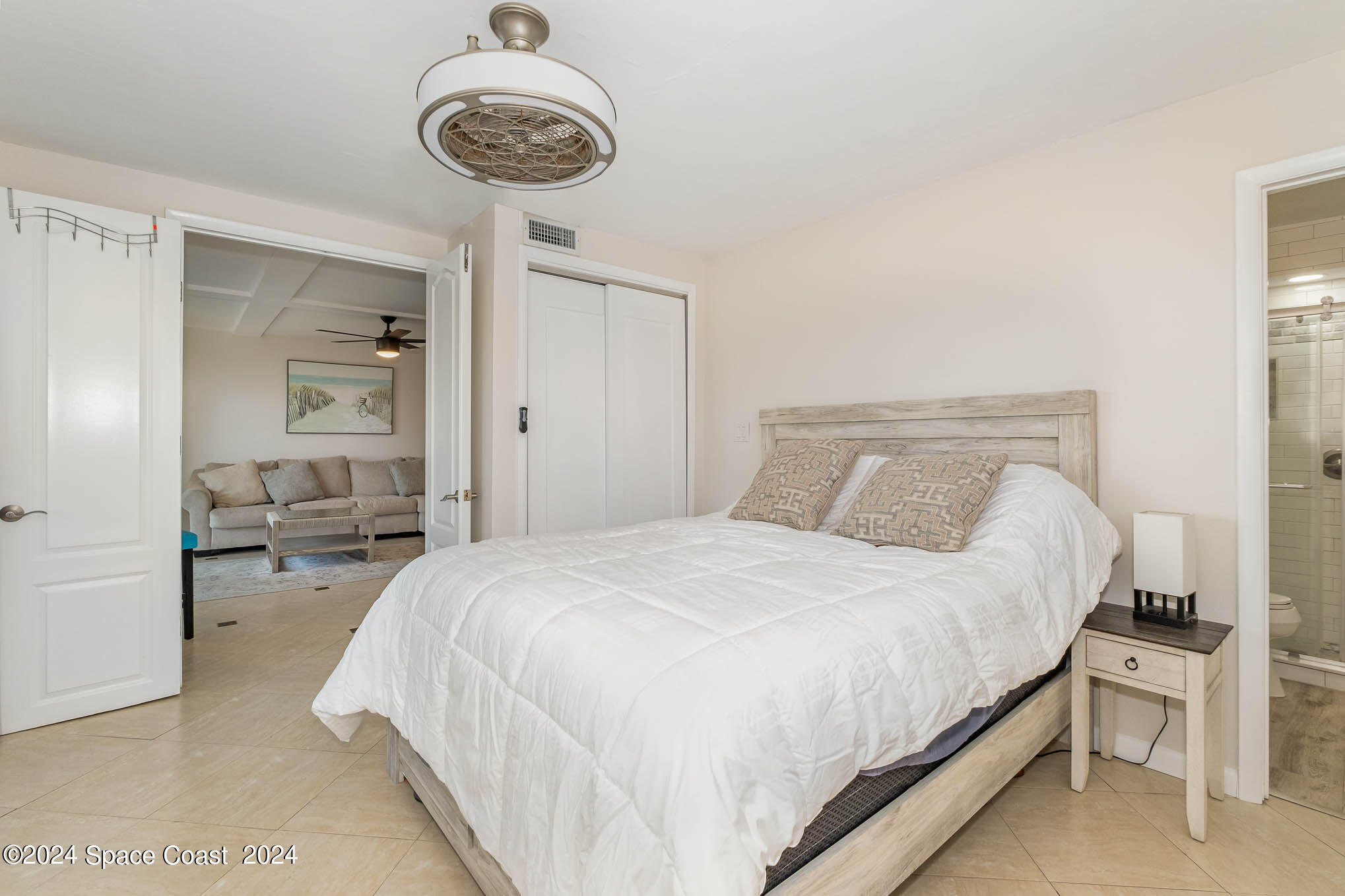 4800 Ocean Beach Boulevard, Unit 311 Cocoa Beach, FL 32931 - Photo 12 of 22 a bedroom with bed and window
