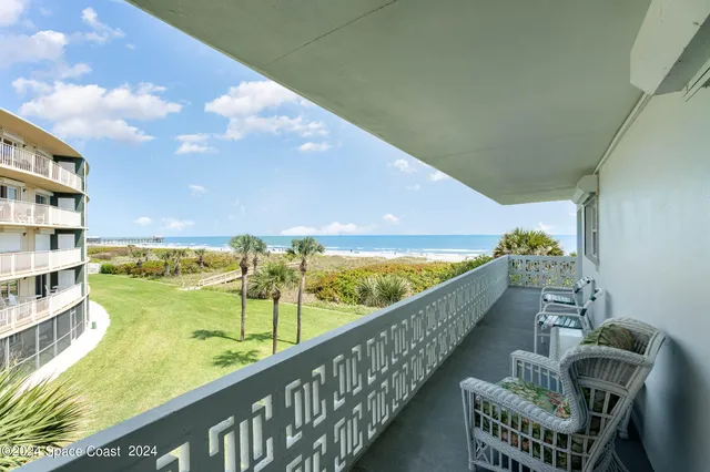 a view of a balcony with an ocean view