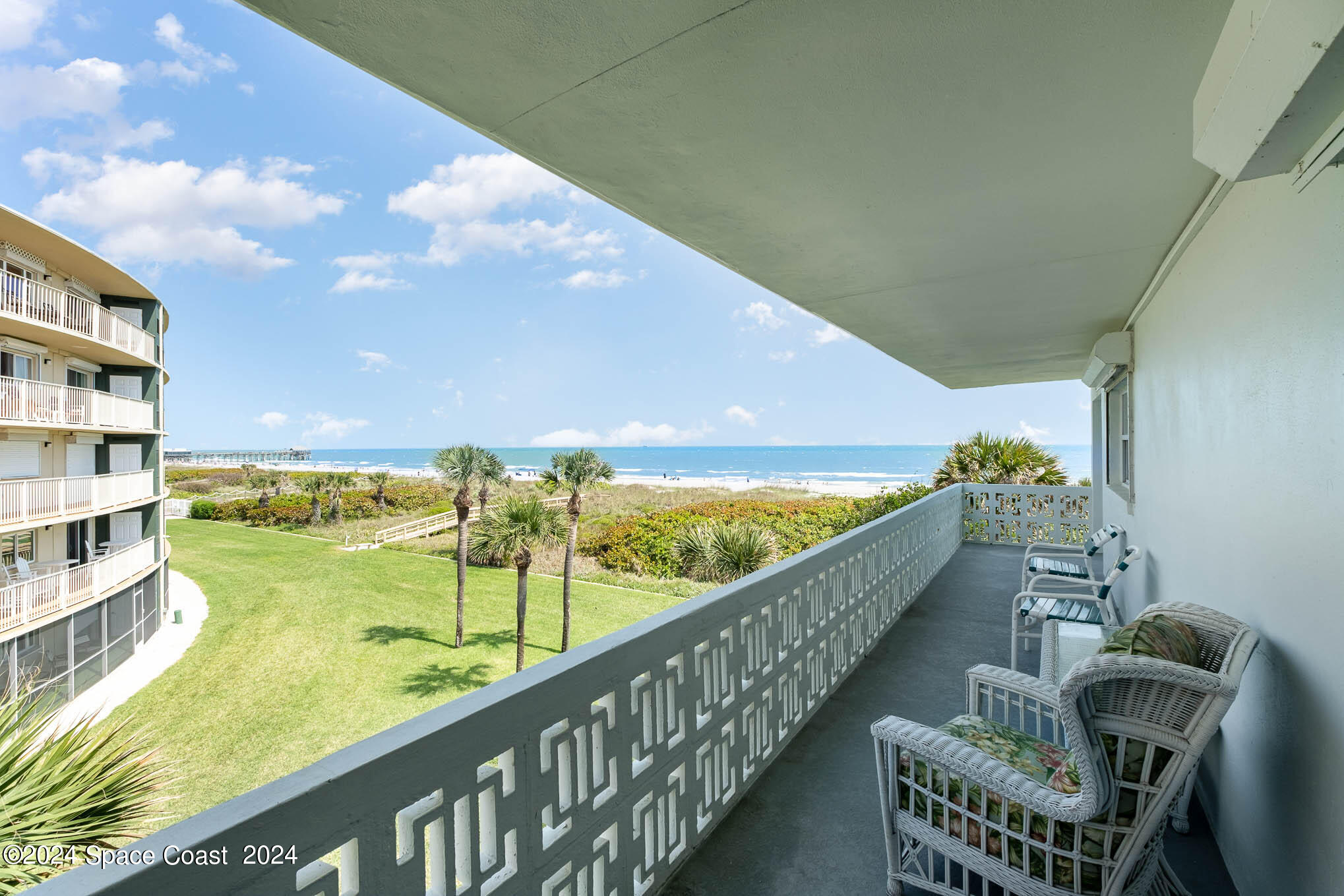 4800 Ocean Beach Boulevard, Unit 311 Cocoa Beach, FL 32931 - Photo 20 of 22 a view of a balcony with an ocean view