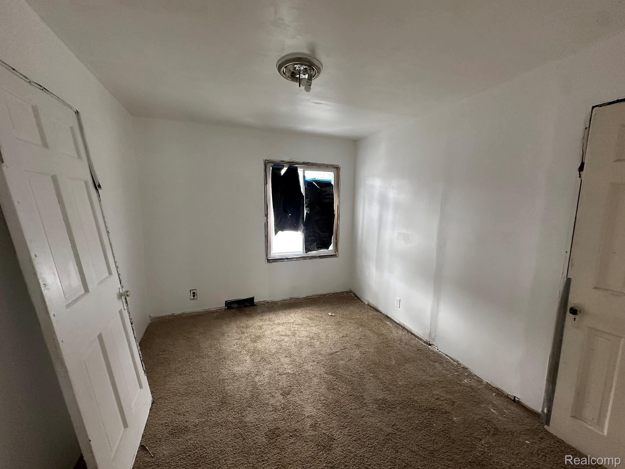 15759 Evergreen Road Detroit, MI 48223 - Photo 8 of 25 Unfurnished bedroom with carpet floors