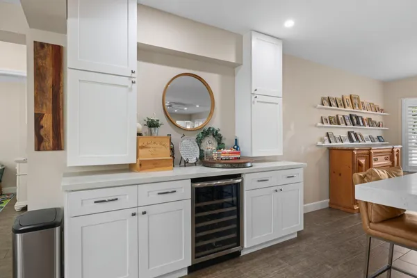 a kitchen with cabinets and window