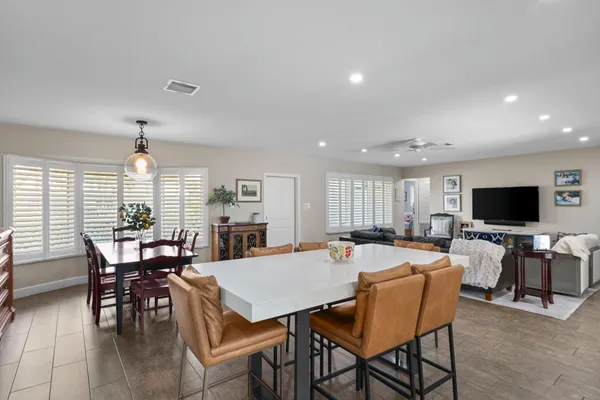 a view of a dining room with furniture window and outside view