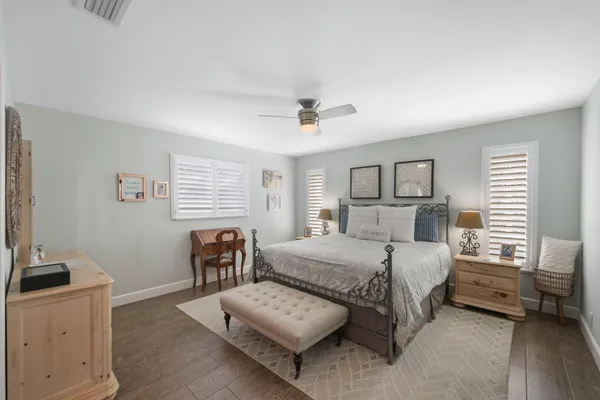a bedroom with a bed and a couch
