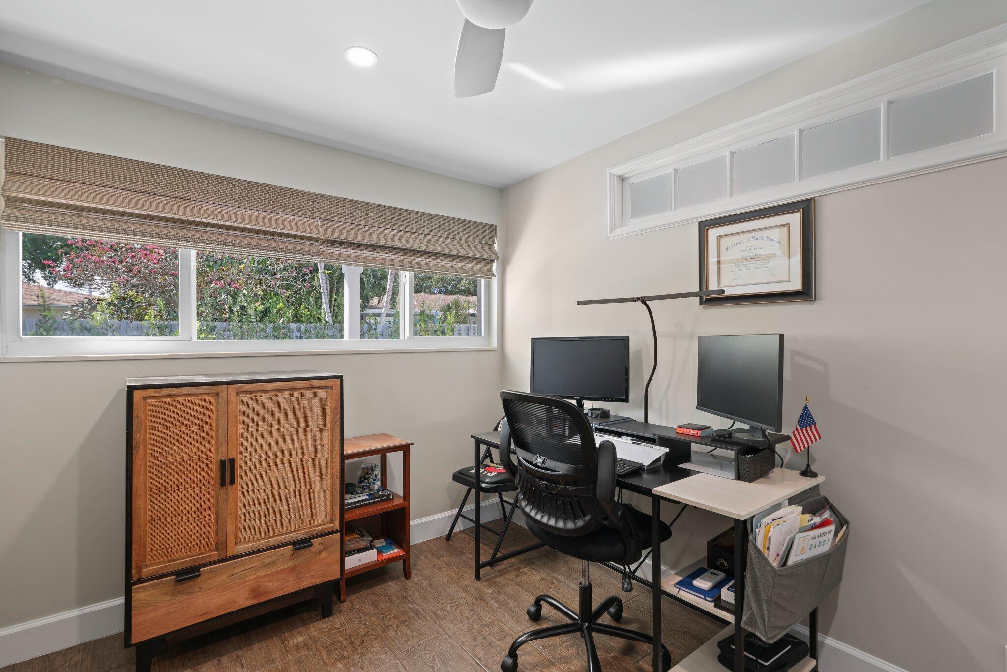 4141 Northeast 22nd Terrace Lighthouse Point, FL 33064 - Photo 27 of 46 a workspace with furniture and a window