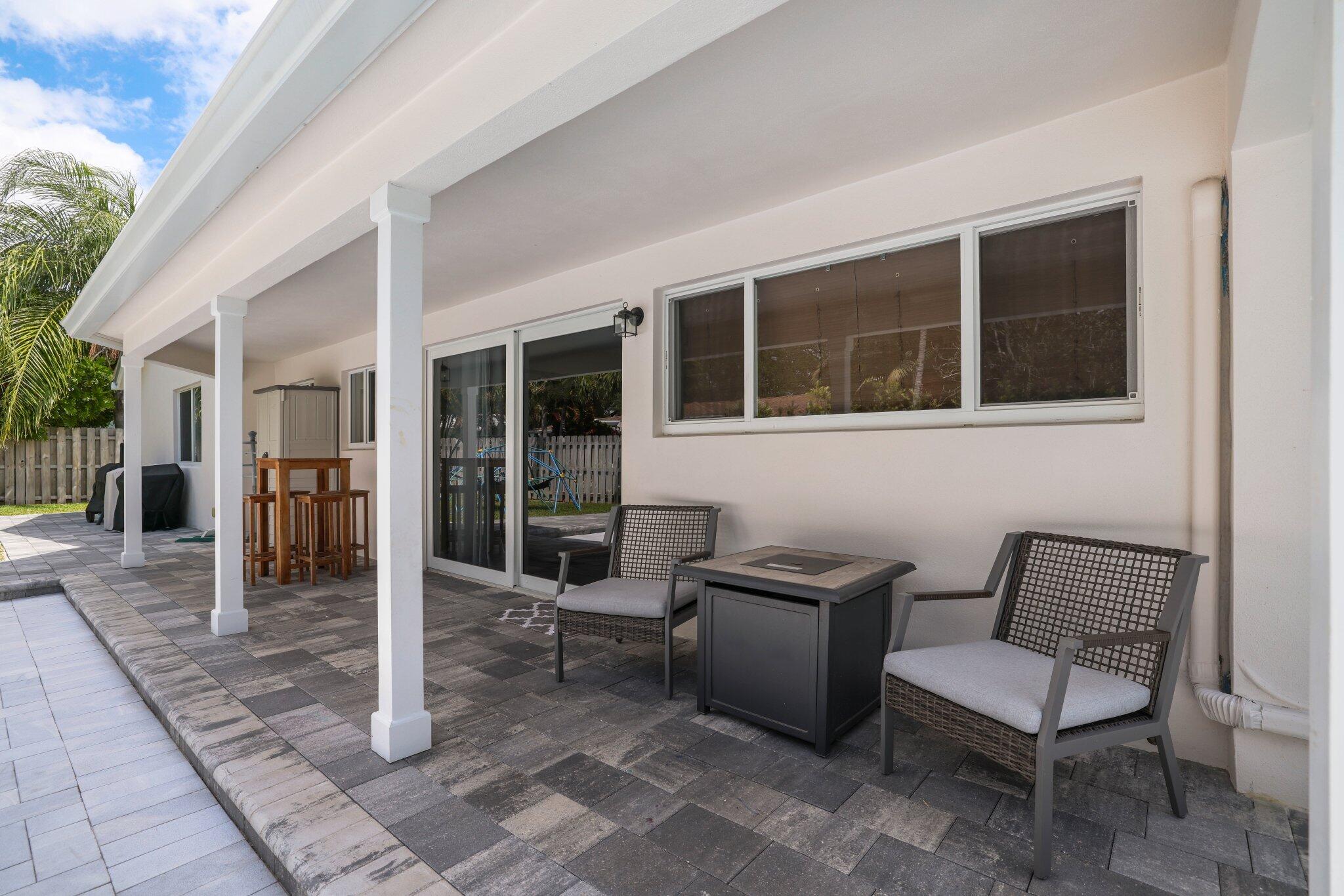4141 Northeast 22nd Terrace Lighthouse Point, FL 33064 - Photo 29 of 46 a balcony with furniture and a potted plant
