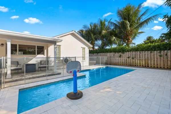 a front view of a house with swimming pool