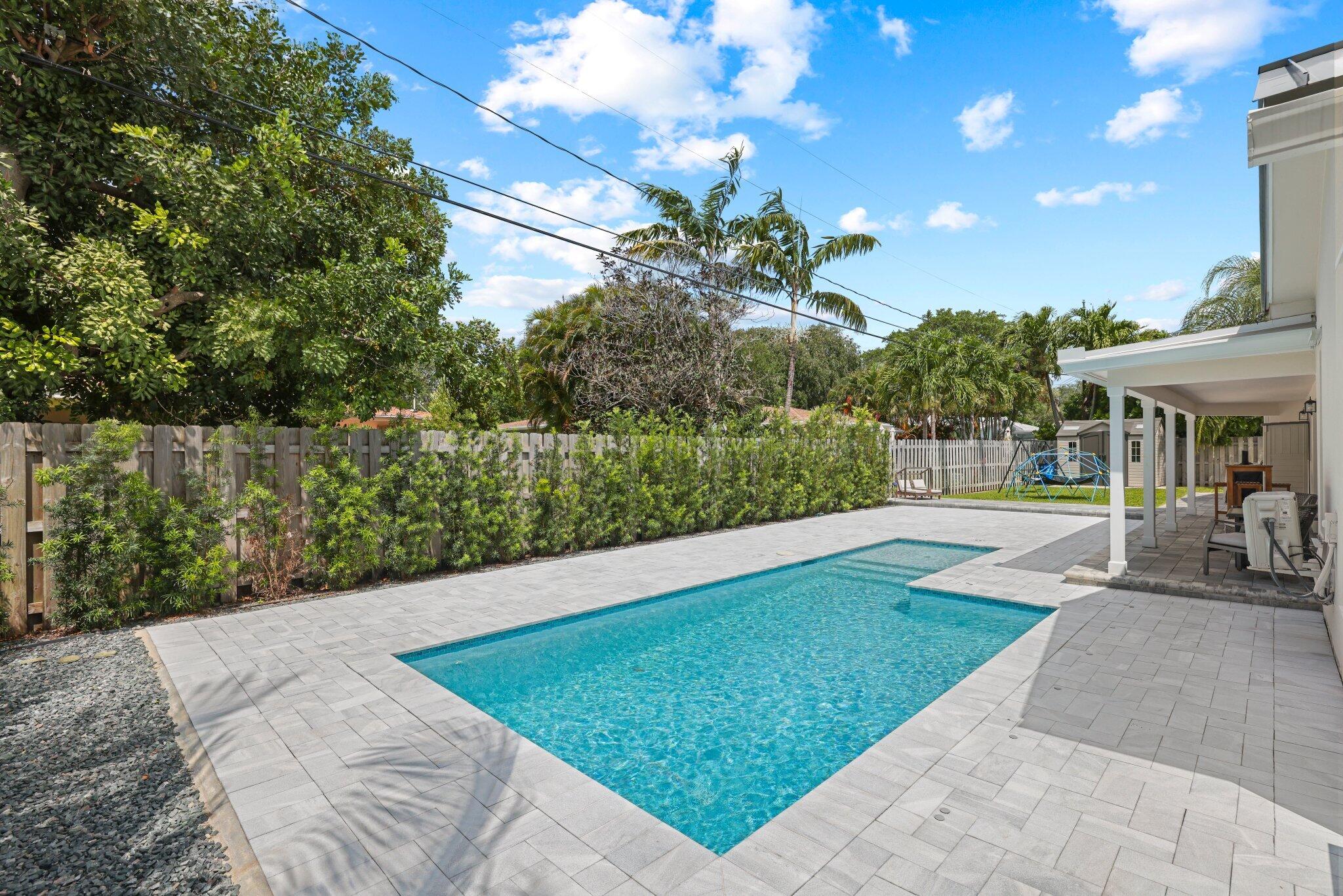 4141 Northeast 22nd Terrace Lighthouse Point, FL 33064 - Photo 33 of 46 a view of a backyard with sitting area