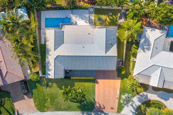 an aerial view of a house with pool