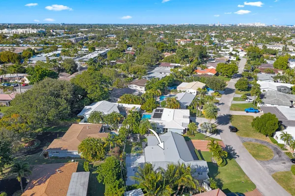 an aerial view of residential houses with outdoor space