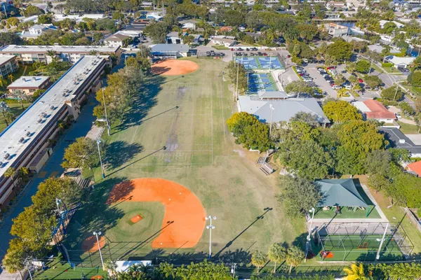 an aerial view of residential houses with outdoor space
