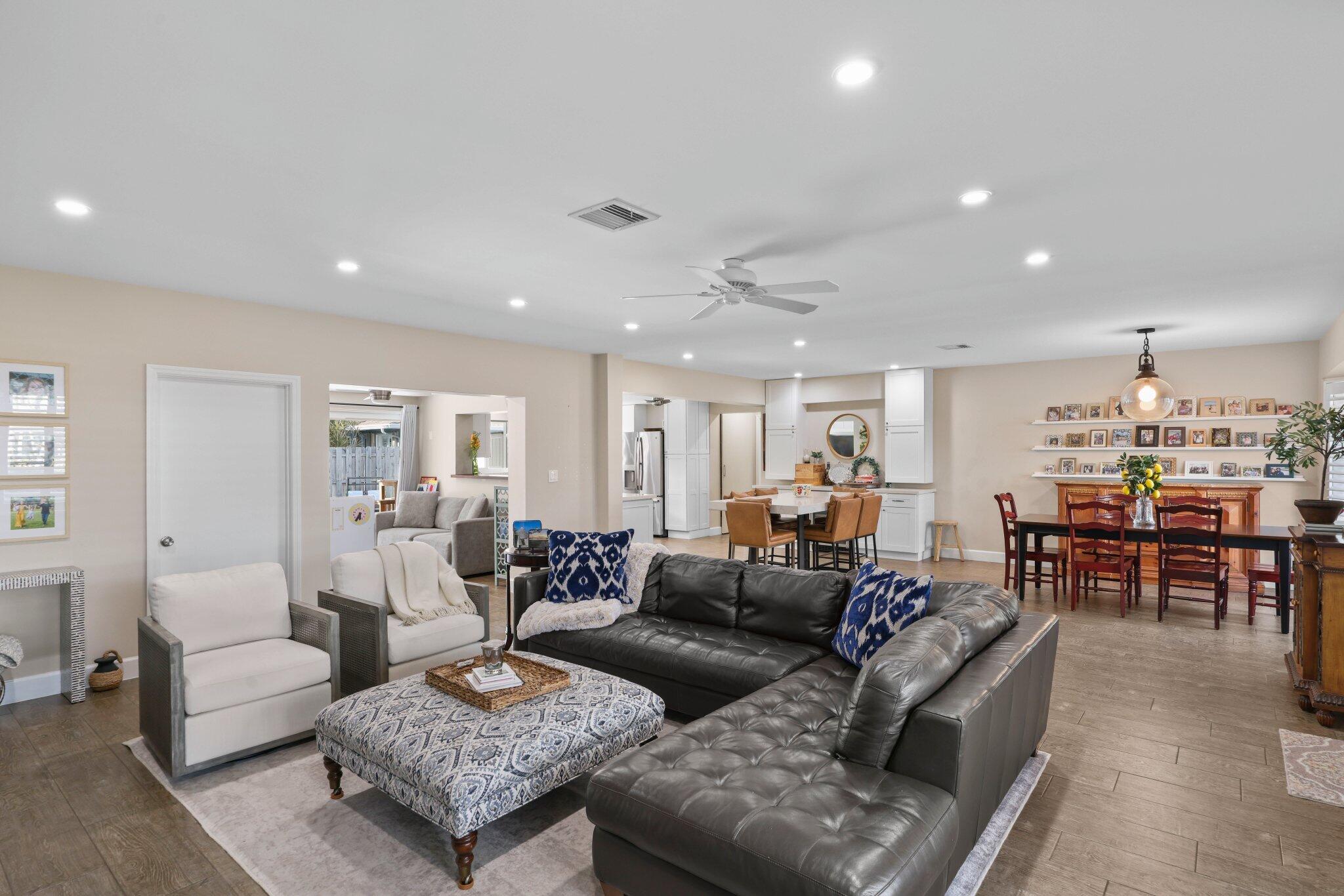 4141 Northeast 22nd Terrace Lighthouse Point, FL 33064 - Photo 5 of 46 a living room with furniture kitchen view and a table