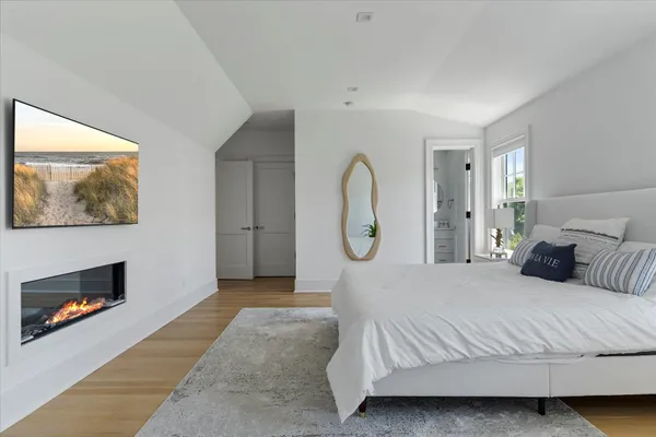 a bed room with a bed and a painting