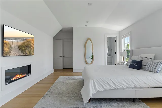 a bed room with a bed and a painting