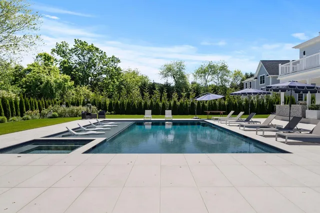 a view of swimming pool with chairs