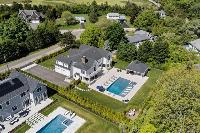 an aerial view of a house with a garden