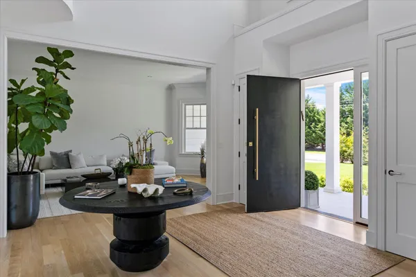 a view of a dining room with furniture and window