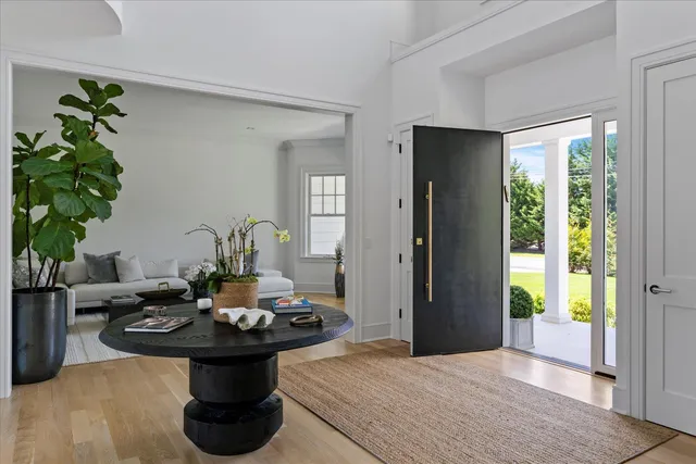 a view of a dining room with furniture and window